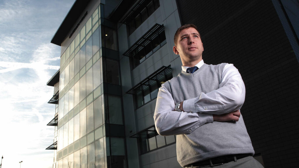 A man stood outside the front of Trafford College